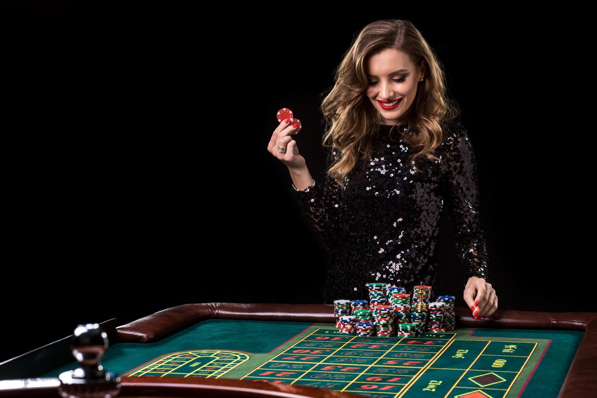 sexy-woman-black-dress-playing-casino-woman-stakes-piles-chips-playing-roulette-casino-club-gambling-roulette